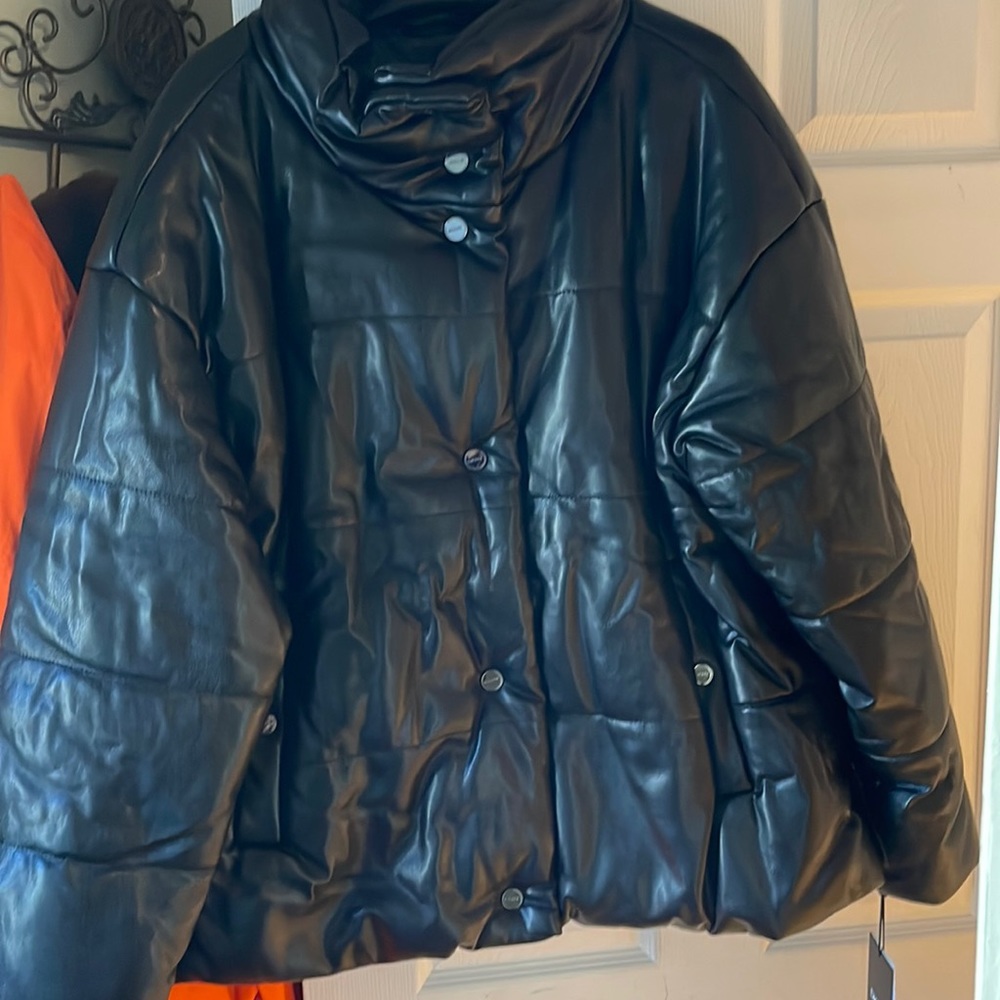 This is a Black Leather puffer coat from DKNY. Size XXL.